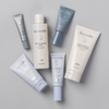 Face Reality Deluxe Age Defense Kit showing Antioxidant Peptide Eye Gel, hydraRemedy™ Gel Serum, Barrier Balance Creamy Cleanser, Antioxidant Peptide Serum, Moisture Balance Toner, and Cran-Peptide Cream laying flat against light background.
