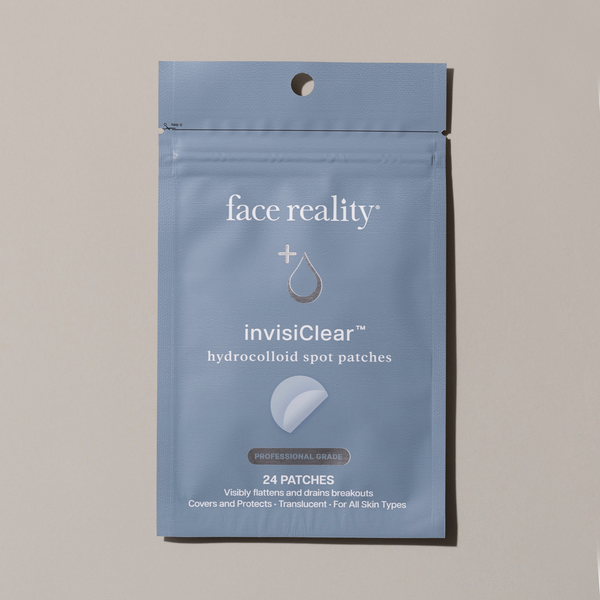 Package of Face Reality invisiClear hydrocolloid spot patches on a beige background