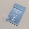 Face Reality invisiClear hydrocolloid spot patches showcased against packaging laying flat on a beige background