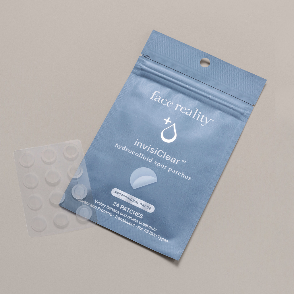 Face Reality invisiClear hydrocolloid spot patches showcased against packaging laying flat on a beige background