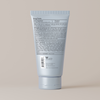 Back view of Face Reality mineral matte spf 28 tube with text on a beige background