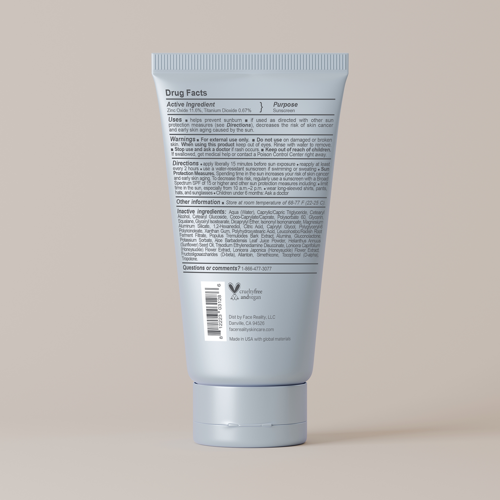 Back view of Face Reality mineral matte spf 28 tube with text on a beige background