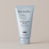 Tube of Face Reality mineral matte SPF 28 sunscreen on a beige background