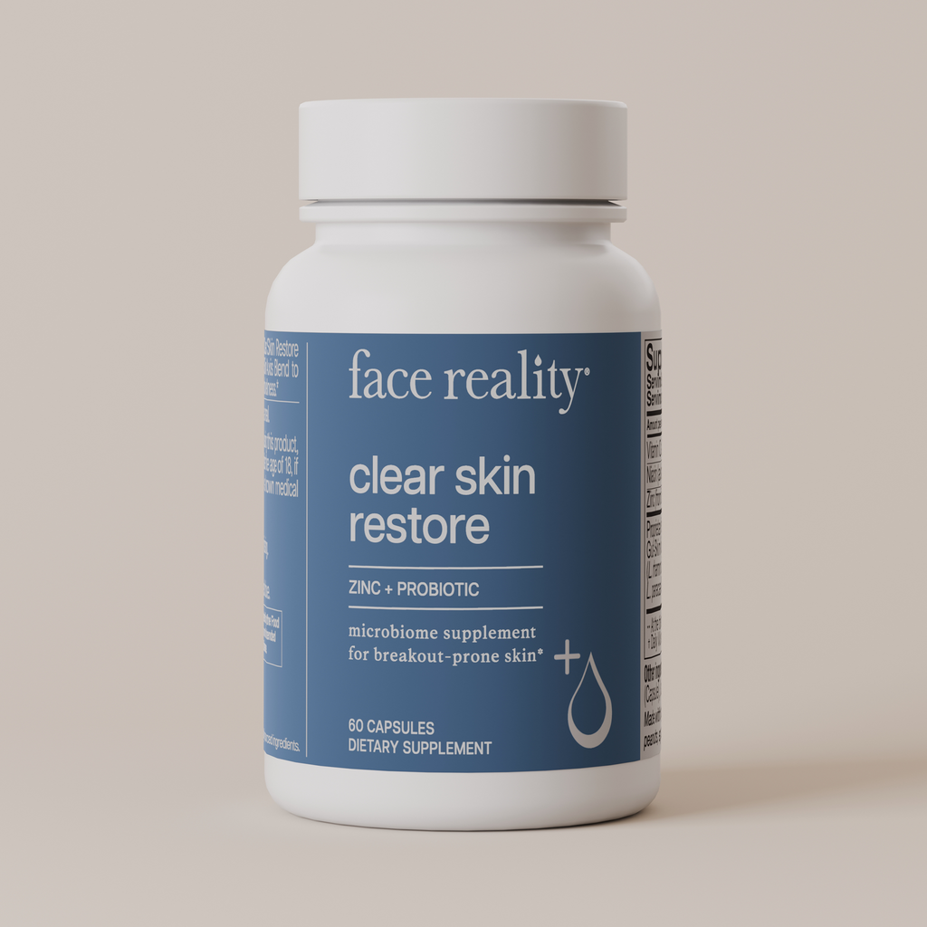 Face Reality Clear Skin Restore product bottle against light beige background
