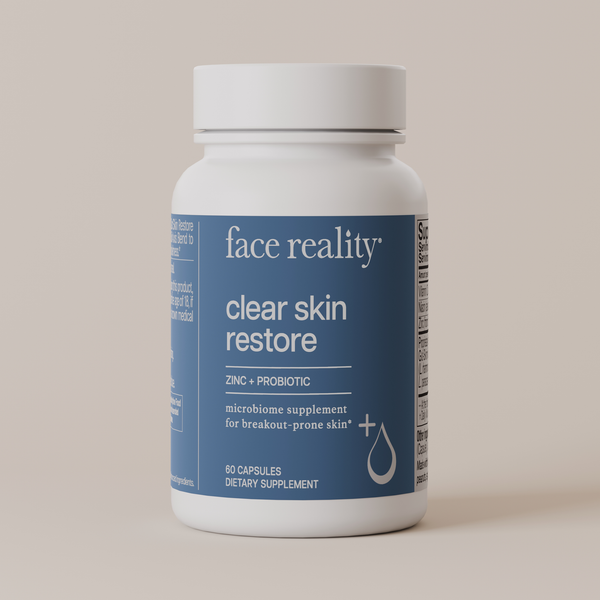 Face Reality Clear Skin Restore product bottle against light beige background