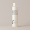 Back label of Face Reality moisture balance toner bottle against light beige background.