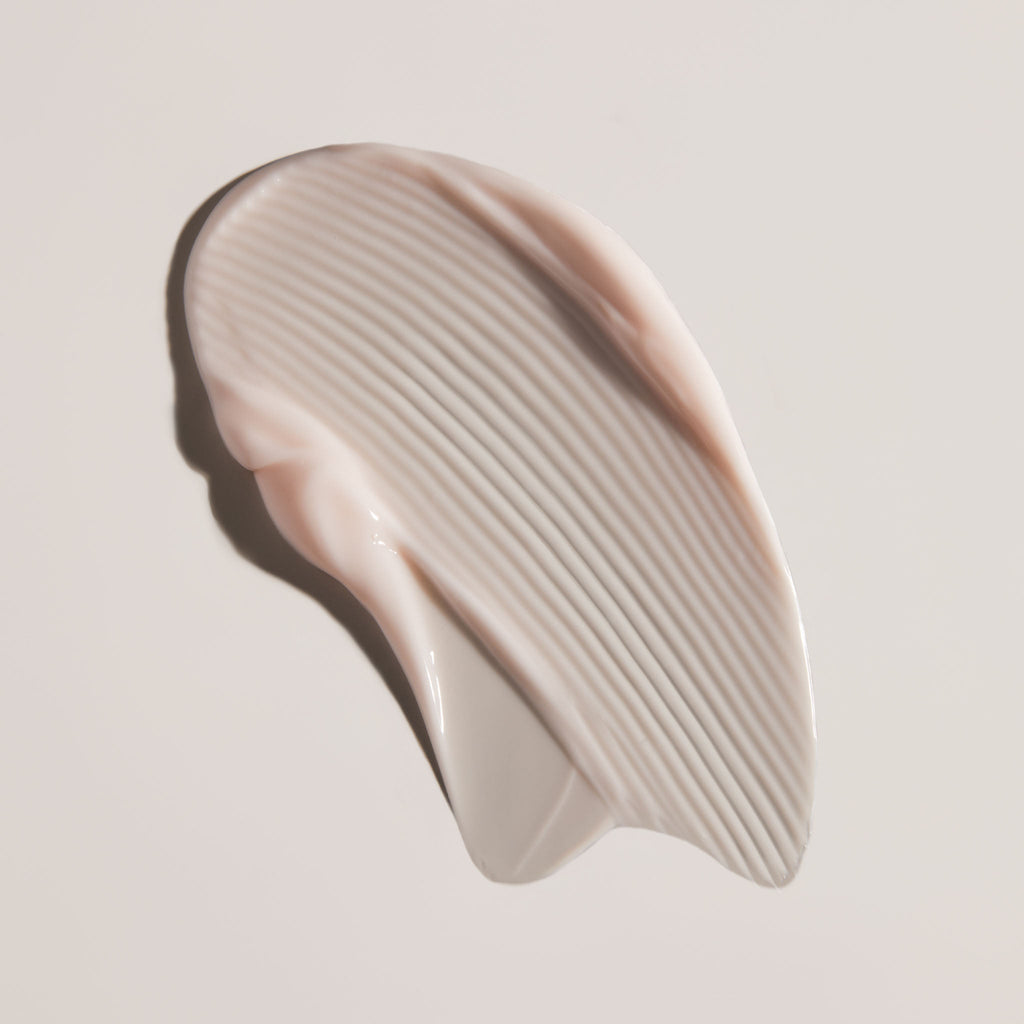 Face Reality cran-peptide cream swatch on a light beige background