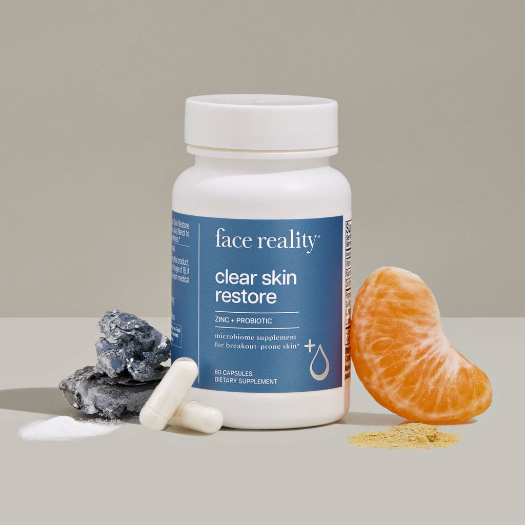 Face Reality ClearSkin Restore product with Ingredient representations of Zinc and Probiotic